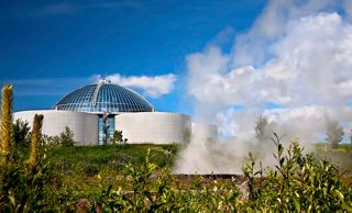 The Perlan Museum in Reykjavik surrounded by lush vegetation and a clear blue sky | MSC Cruises