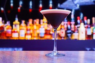 A stylish cocktail sits elegantly on a bar counter, inviting enjoyment at the Liquid Disco aboard MSC Fantasia | MSC Cruises