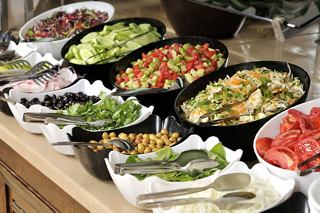 A vibrant buffet spread featuring a variety of fresh vegetables and salads for a delightful dining experience | MSC Cruises