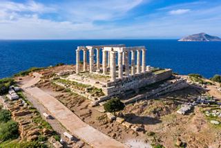 Aerial view of the Poseidon Temple at Cape Sounio overlooking the Aegean Sea and clear blue sky | MSC Cruises