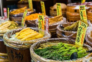 A vibrant display of traditional Japanese food items in a market, showcasing a variety of fresh ingredients | MSC Cruises