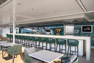 A modern bar counter in the MSC Aurea Spa, featuring elegant seating and a welcoming atmosphere | MSC Cruises