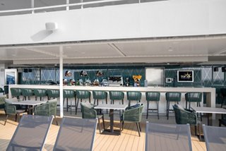 A spacious bar counter area with a welcoming design, perfect for relaxation and enjoyment | MSC Cruises