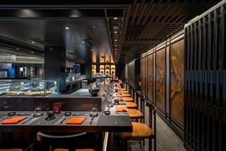Stylish interior of Kaito Sushi Bar with elegant lighting and seating, inviting guests to enjoy a delightful dining experience | MSC Cruises