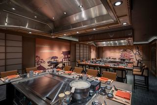 A vibrant dining area showcasing the Kaito Teppanyaki restaurant with modern decor and seating arrangements | MSC Cruises