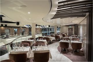 A welcoming dining area featuring elegant seating and a vibrant atmosphere for guests to enjoy culinary delights | MSC Cruises