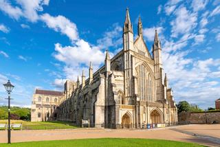 A majestic cathedral stands under a bright blue sky, showcasing its stunning architecture in the United Kingdom | MSC Cruises