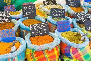 A vibrant local market display featuring colourful spices in containers | MSC Cruises