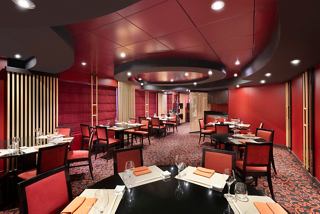 A vibrant dining area featuring tables and chairs, creating an inviting atmosphere at Kaito Sushi Bar | MSC Cruises