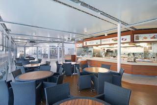 A warm dining area with tables and chairs, inviting guests to enjoy delicious meals aboard MSC Lirica | MSC Cruises