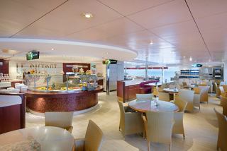 A spacious dining area with tables and chairs, inviting guests to enjoy a variety of dishes together | MSC Cruises