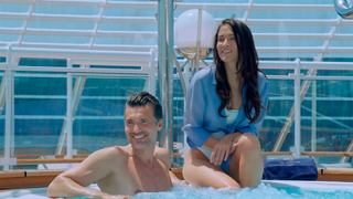 A man and woman relax together by the pool, enjoying life aboard MSC Yacht Club | MSC Cruises