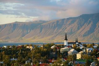 A scenic view of Reykjavik with Mount Esja in the background, showcasing the beauty of Iceland's landscape | MSC Cruises