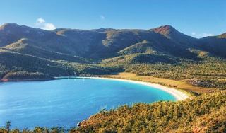 Wineglass Bay in Tasmania, Australia featuring blue sea and lush coastal vegetation | MSC Cruises