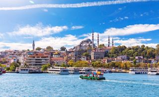 A scenic view of Istanbul’s vibrant skyline with boats in the sea and historic architecture | MSC Cruises