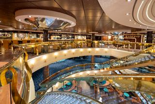 A stylish lounge area on MSC Fantasia featuring elegant seating and a welcoming bar atmosphere | MSC Cruises