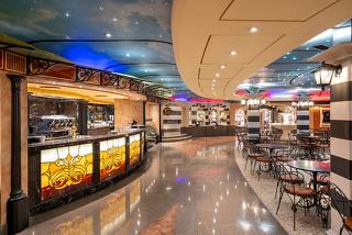 A vibrant bar area in the Piazza San Giorgio aboard MSC Fantasia, inviting relaxation and socialising | MSC Cruises