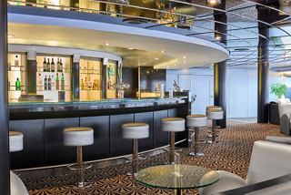 Cozy seating area with bar on MSC Armonia in Starlight Disco | MSC Cruises