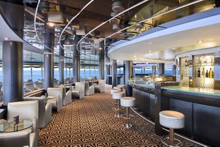 Entertainment area with disco floor, bar, and seating on MSC Armonia ship | MSC Cruises