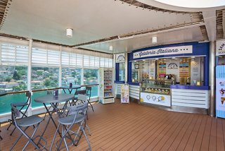 A welcoming outdoor area featuring seating and a gelateria, perfect for enjoying Italian ice cream with sea views | MSC Cruises