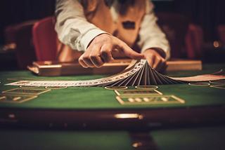 A croupier deals cards at the Sanremo Casino onboard MSC Sinfonia, creating an exciting atmosphere for guests | MSC Cruises