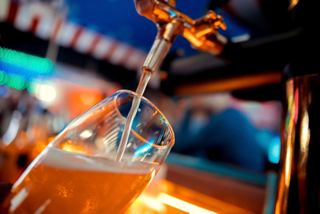 A close-up of a draft beer tap at the Sottovento Pub, highlighting the vibrant atmosphere on board | MSC Cruises