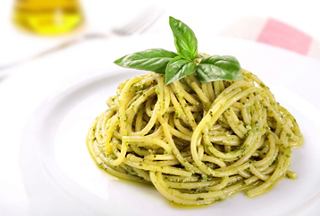 A delicious serving of spaghetti with pesto and fresh basil, representing Italian cuisine | MSC Cruises