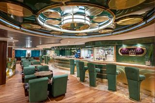 A stylish bar area with green seating and a vibrant ceiling, inviting guests to relax and enjoy refreshments | MSC Cruises