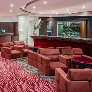 A welcoming bar area with comfortable seating and a stylish counter for relaxation on MSC Splendida | MSC Cruises