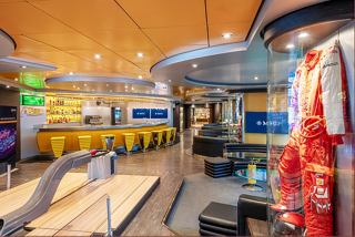 A vibrant lounge area on MSC Splendida featuring a bar counter, comfortable seating, and entertainment options | MSC Cruises