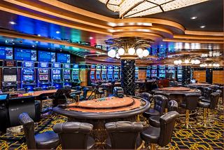 A vibrant casino area with gaming tables and slot machines for entertainment aboard MSC Splendida | MSC Cruises