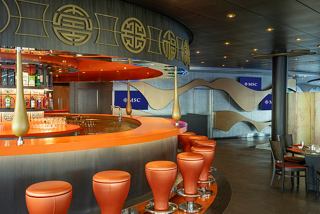 A vibrant bar area with stylish seating and a welcoming atmosphere in the Sea Pavilion restaurant on MSC Splendida | MSC Cruises