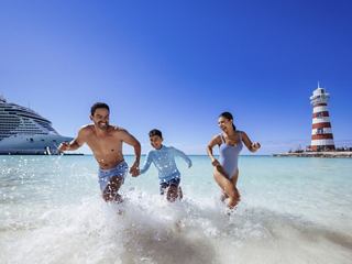 A family plays on the beach, enjoying the sun and the sea | MSC Cruises