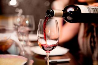 A glass of red wine being poured, enhancing the dining experience aboard MSC Splendida | MSC Cruises