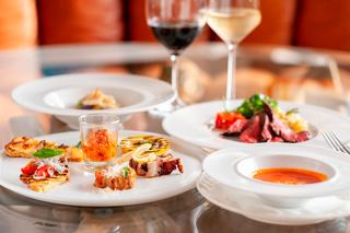 A beautifully arranged selection of appetizers and wine at La Reggia Restaurant aboard MSC Splendida | MSC Cruises