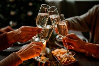 A joyful toast with champagne flutes at a festive gathering in the Safari Lounge aboard MSC Preziosa | MSC Cruises