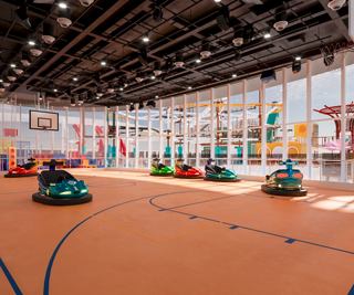 Un espacio interior vibrante lleno de coches de choque coloridos, invitando a la diversión y la risa para todas las edades | MSC Cruceros