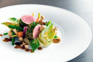 A gourmet dish featuring meat and vegetables, beautifully presented at the Quattro Venti Restaurant | MSC Cruises
