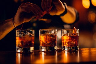 Whiskey being poured into glasses at The Red Bar on MSC Armonia, inviting moments of relaxation and enjoyment | MSC Cruises