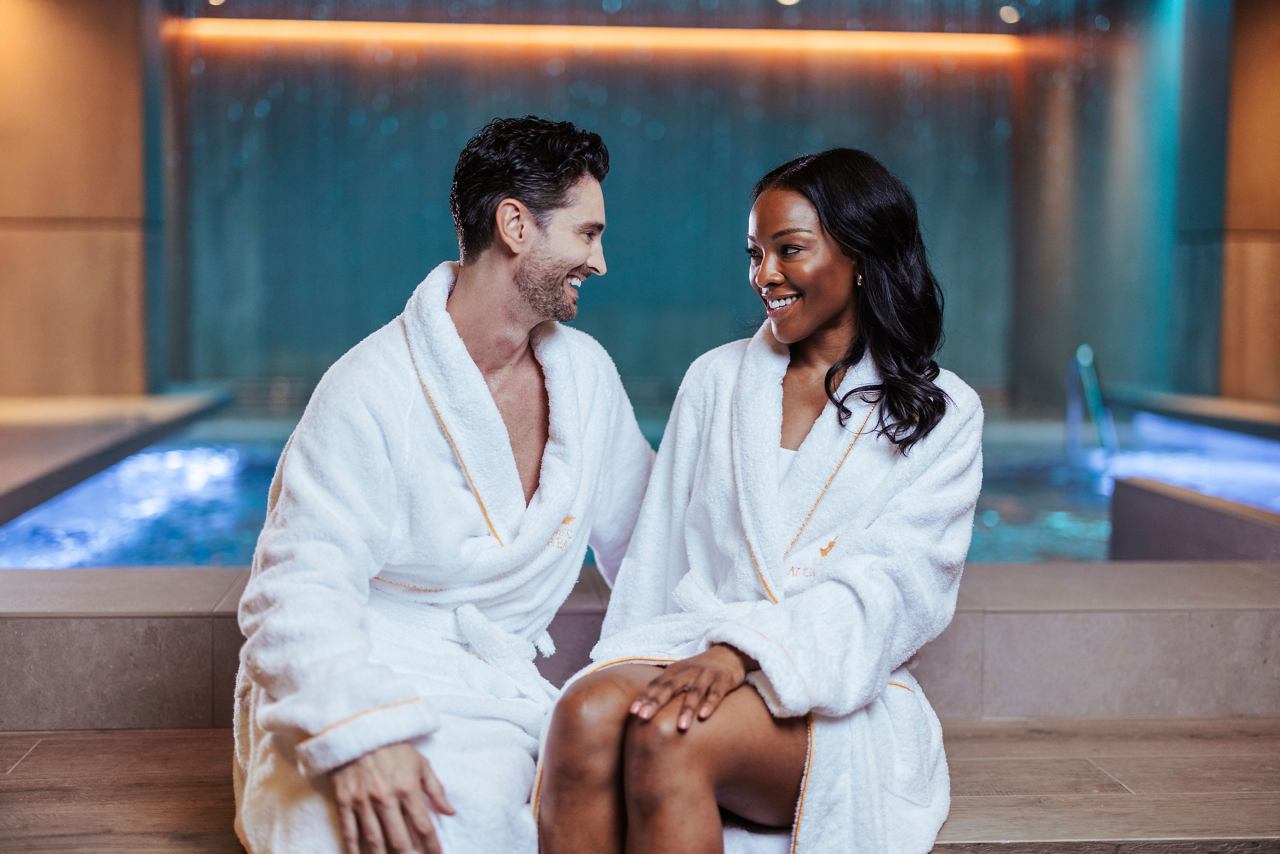 A couple in bathrobes enjoy a moment of relaxation together at MSC Aurea Spa's thermal area | MSC Cruises
