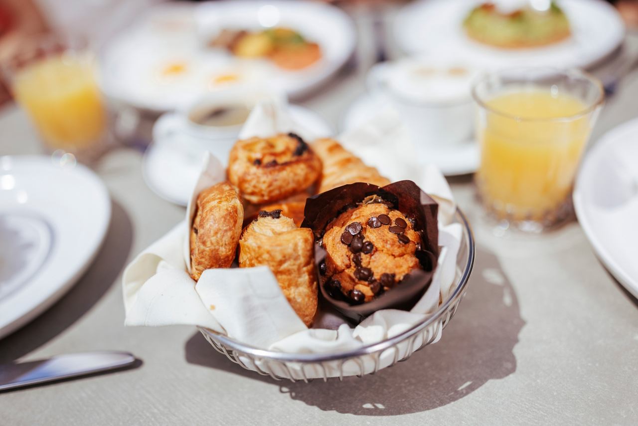 A delightful breakfast spread featuring pastries and juice in the MSC Yacht Club Grill & Bar | MSC Cruises