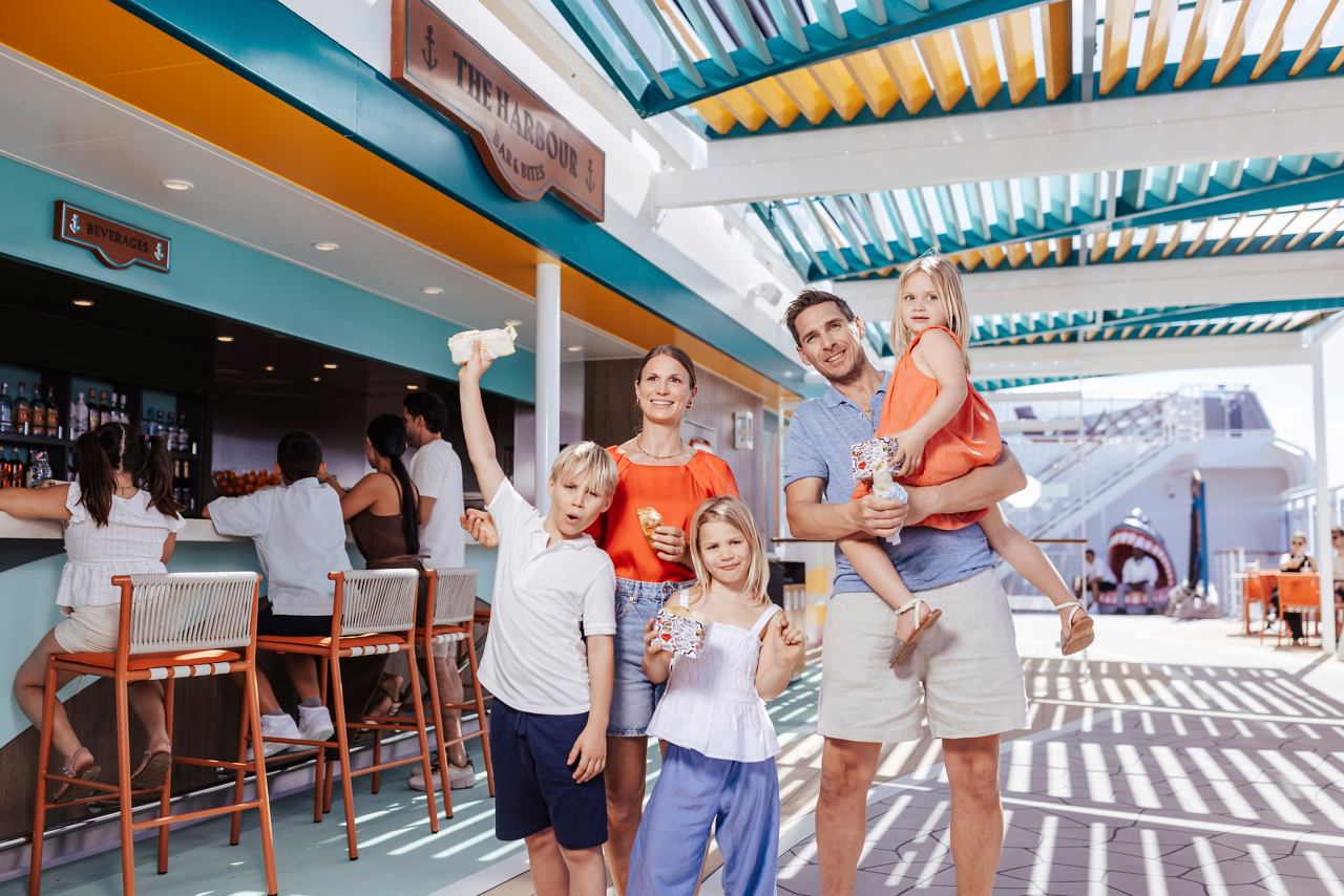 A family enjoys quality time together at The Harbour Bar & Bites on board MSC World America | MSC Cruises