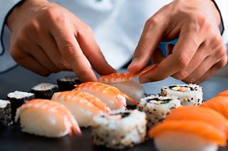 A chef skillfully prepares sushi at Kaito Sushi Bar on MSC Virtuosa | MSC Cruises