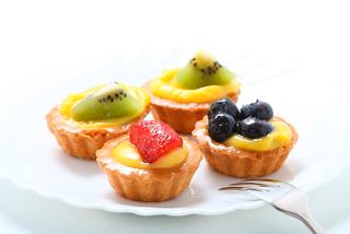 Delightful fruit tarts featuring cream and vibrant toppings served at La Piazzetta Bar on MSC Splendida | MSC Cruises