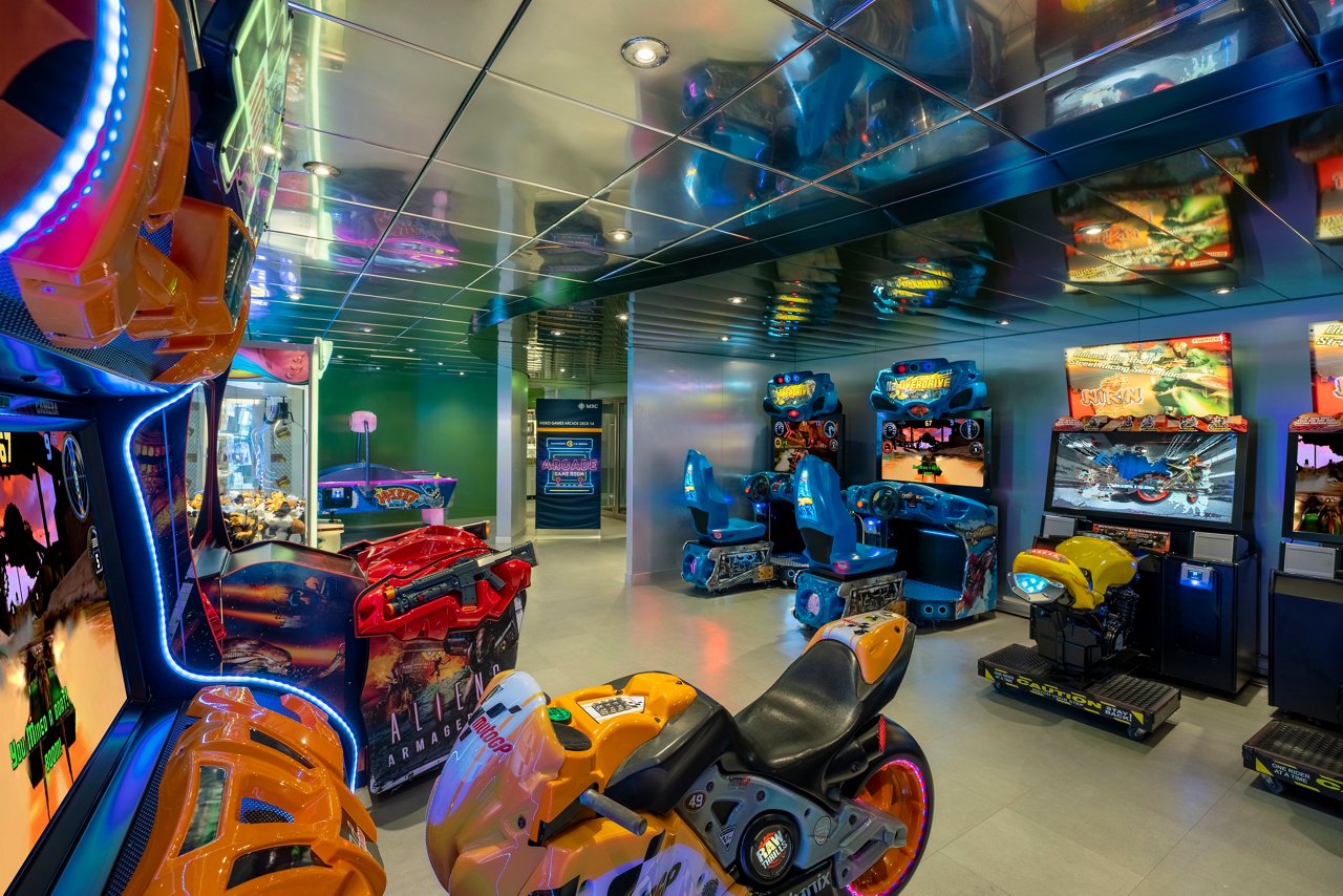 A vibrant family entertainment area filled with various virtual games aboard the MSC Poesia ship | MSC Cruises