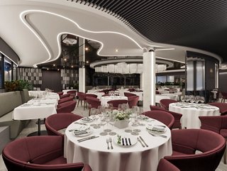 Elegant dining setup in the MSC Yacht Club Restaurant with round tables and a stylish interior | MSC Cruises