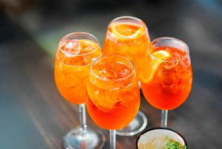 Refreshing Aperol Spritz cocktails served in elegant glasses, perfect for enjoying at the Shine Bar on MSC Seascape | MSC Cruises