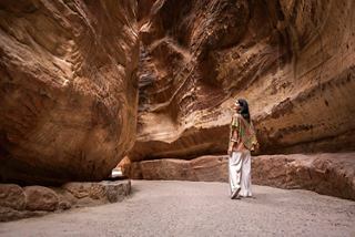 Woman explores an archaeological site in Jordan, surrounded by majestic rocks | MSC Cruises
