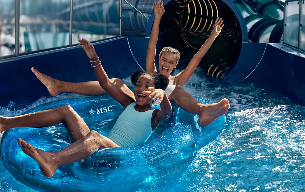 Children enjoy a water slide in the water park on a cruise ship | MSC Cruises