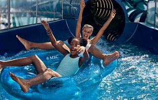 Children enjoy a water slide in the water park on a cruise ship | MSC Cruises